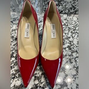 Red Jimmy Choo patent pump heels